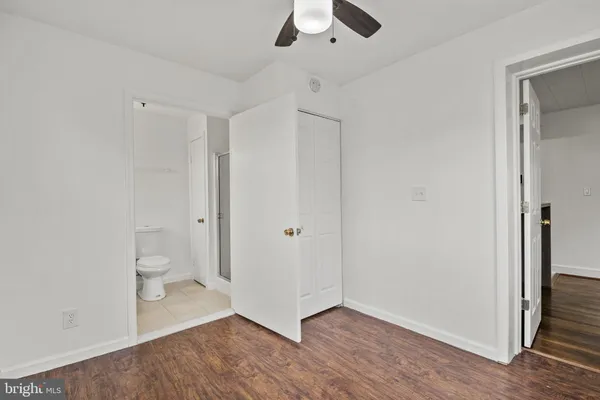 a bathroom with a sink a mirror and a toilet