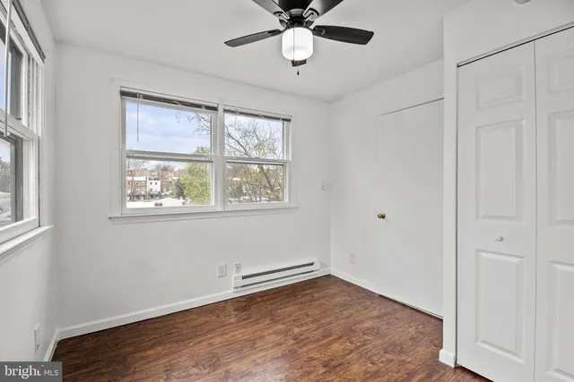 a bathroom with a shower and a toilet