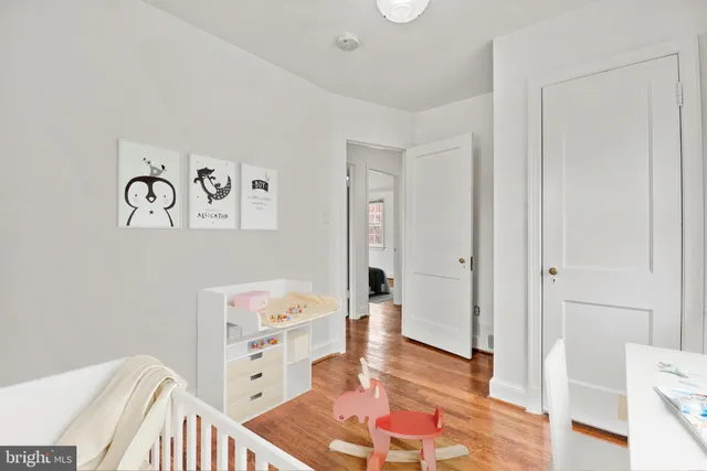 a view of an empty room and wooden floor