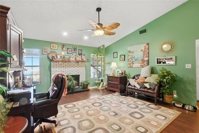 a kitchen with stainless steel appliances a sink a stove top oven a counter space and cabinets