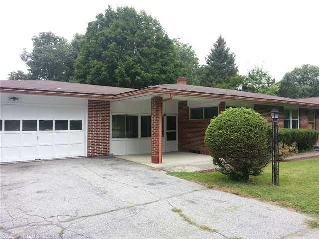 373 Wauregan Road Killingly, CT 06239 - Photo 1 of 1 a view of a house with a yard and plants