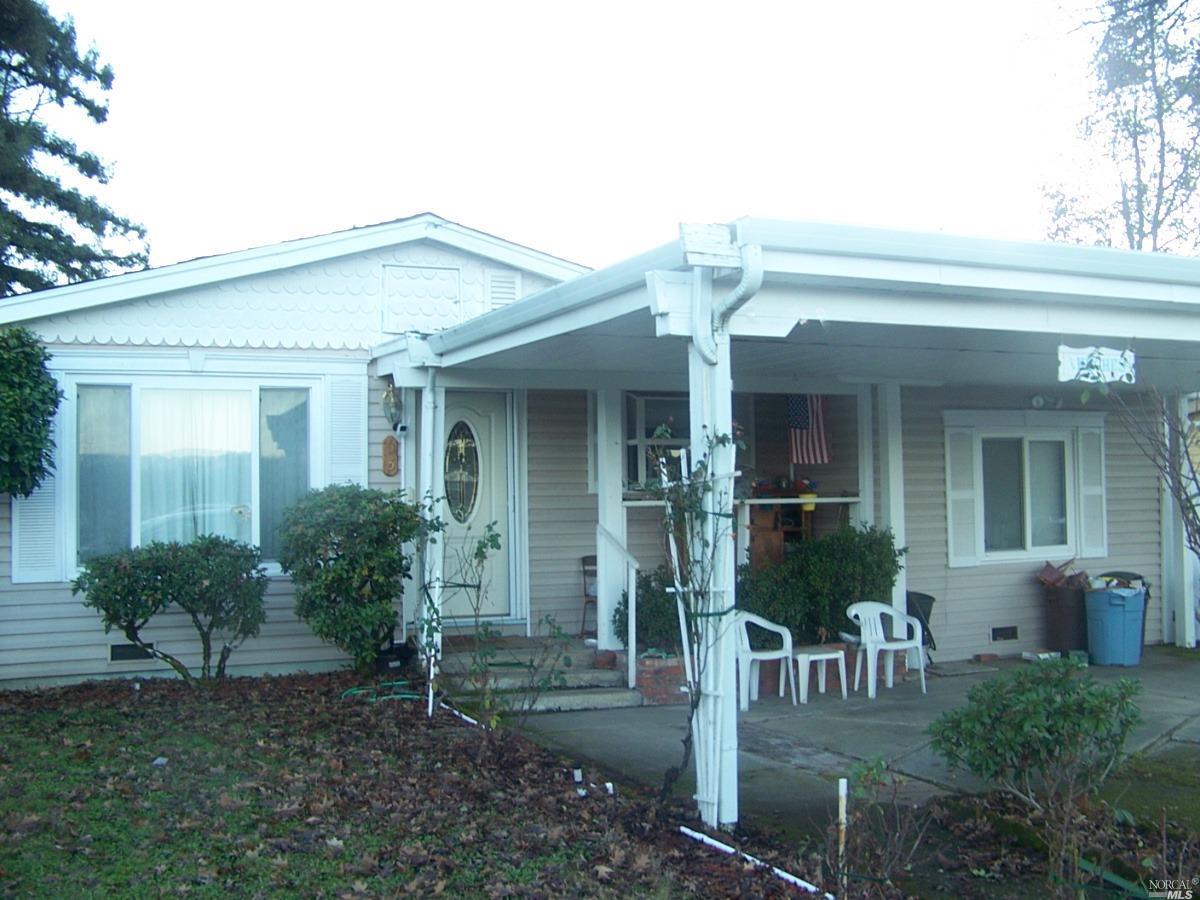a view of house with patio outdoor seating space