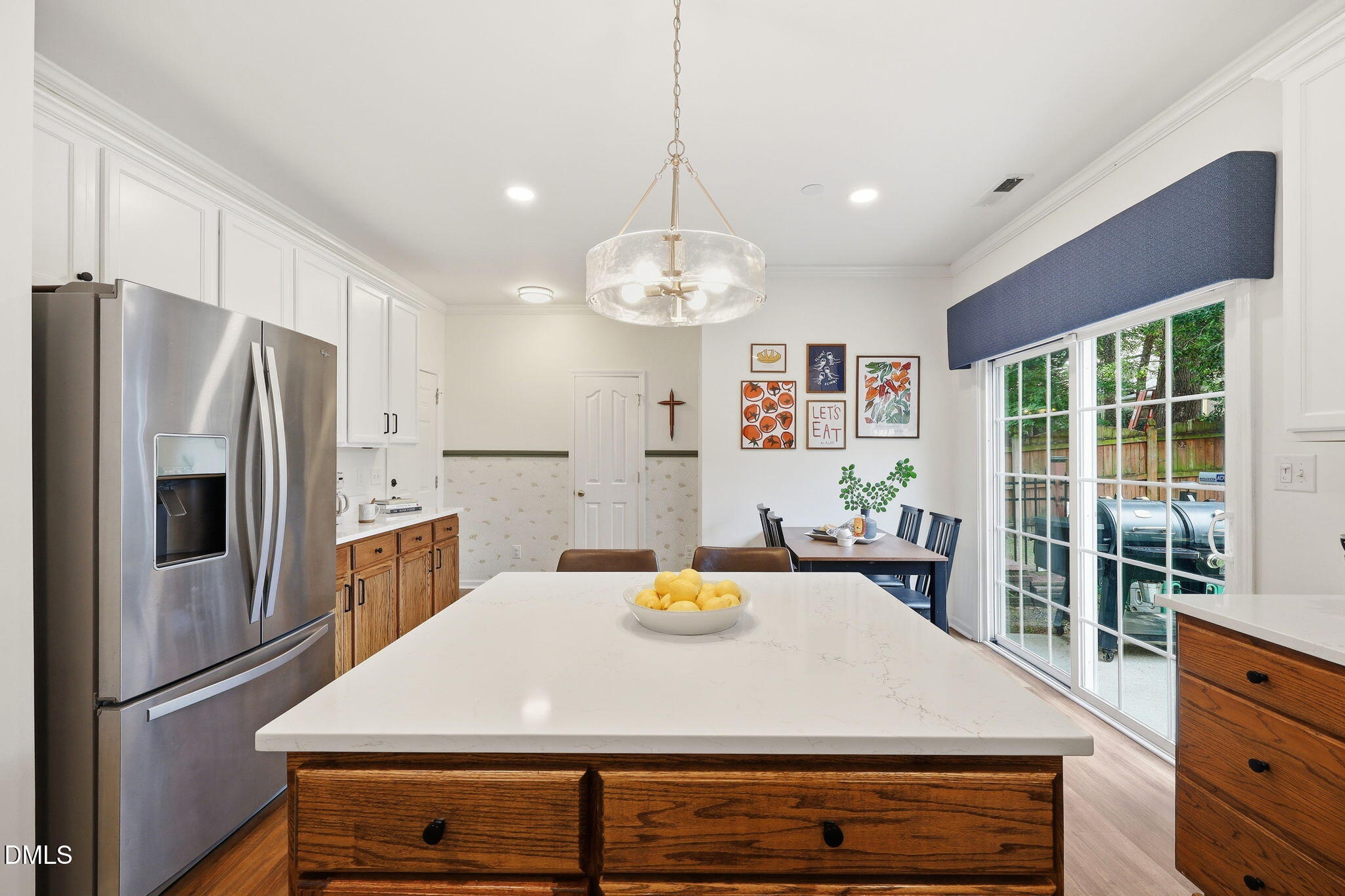 5629 Enoree Lane Raleigh, NC 27616 - Photo 11 of 38 a kitchen with a refrigerator and a stove top oven