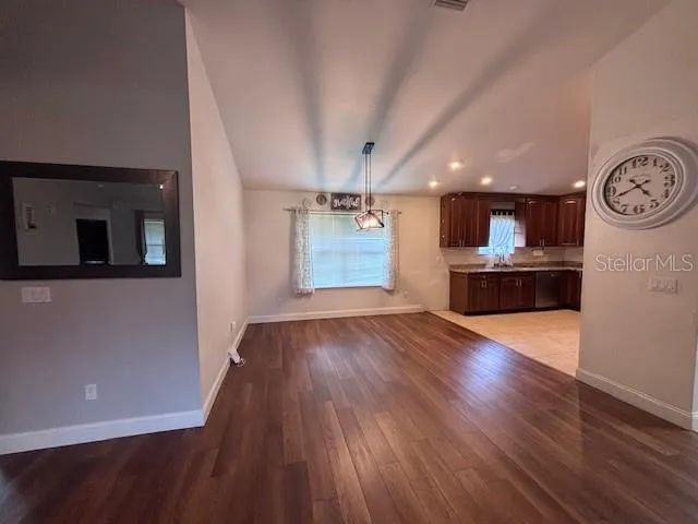 a view interior of a house kitchen wooden floor and window