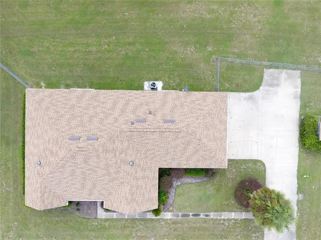 swimming pool view with a garden