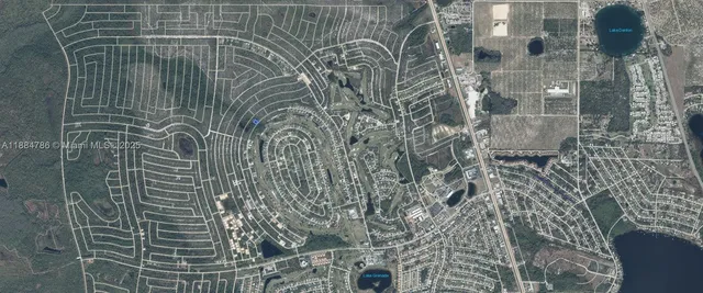 an aerial view of a house with a lake view