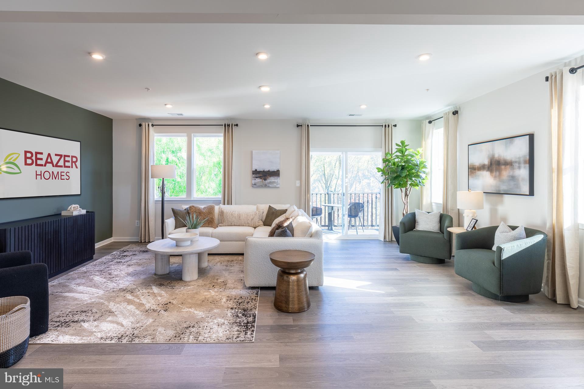 9990 B Justify Run Laurel, MD 20723 - Photo 7 of 13 a living room with fireplace furniture and a wooden floor