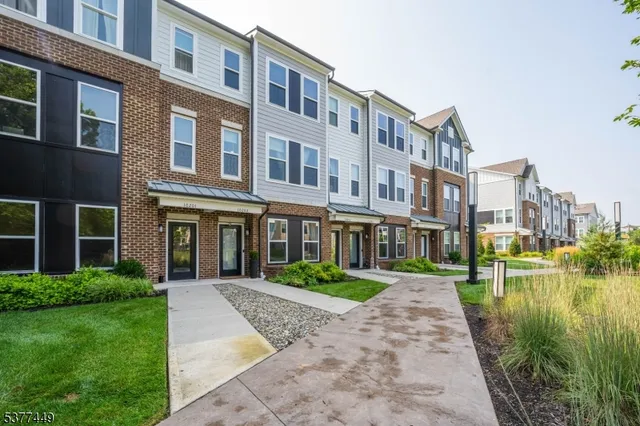 a front view of a building with garden