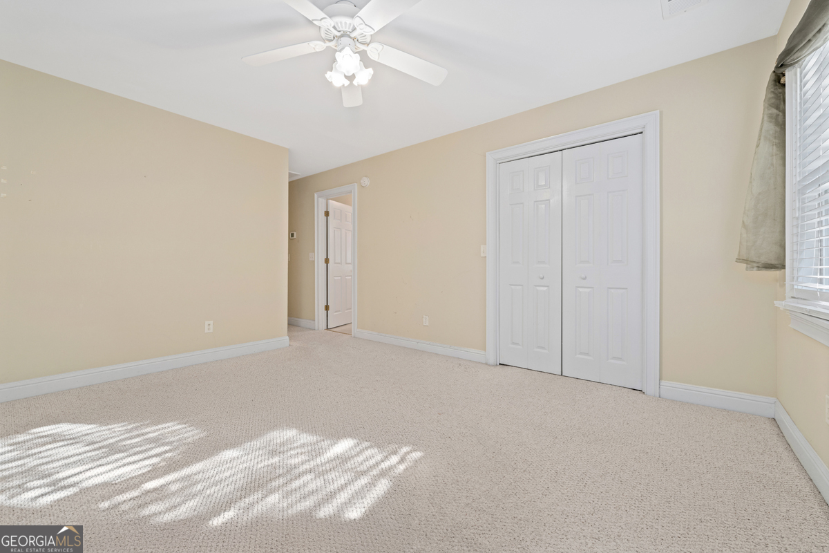 122 Hodges Lane Hartwell, GA 30643 - Photo 16 of 37 a view of an empty room with a window