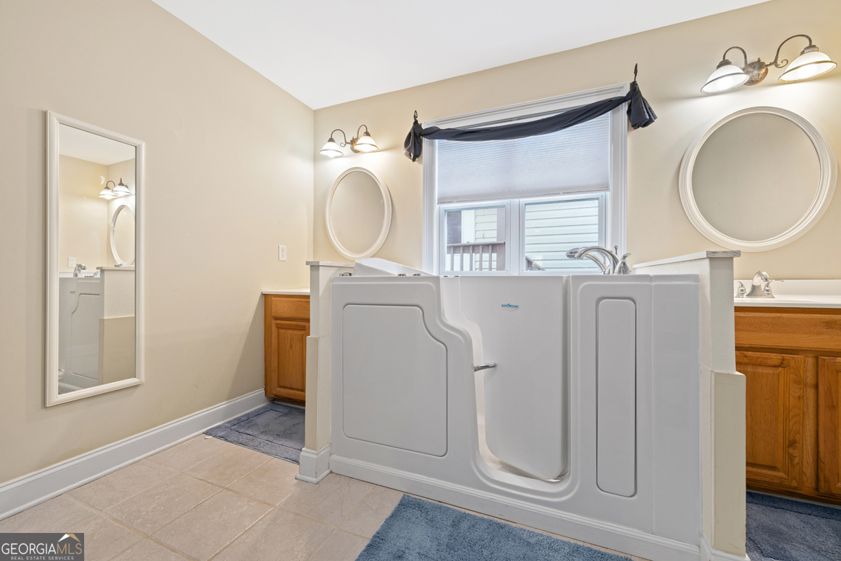 122 Hodges Lane Hartwell, GA 30643 - Photo 18 of 37 a bathroom with a mirror a sink and a mirror