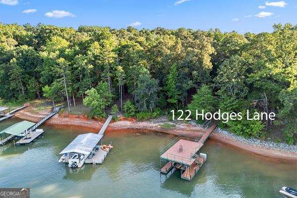 122 Hodges Lane Hartwell, GA 30643 - Photo 2 of 37 a view of a backyard with swimming pool