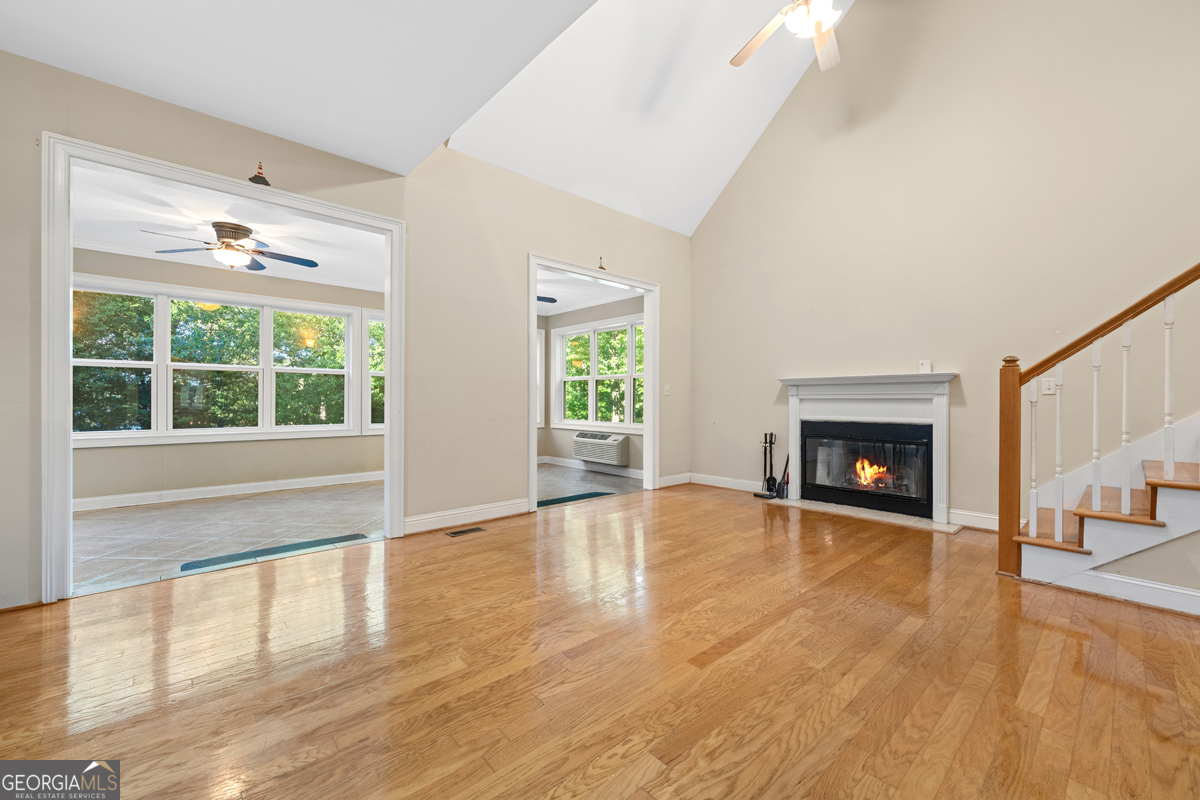 122 Hodges Lane Hartwell, GA 30643 - Photo 25 of 37 a view of an empty room with wooden floor and a window