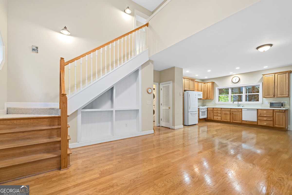 122 Hodges Lane Hartwell, GA 30643 - Photo 28 of 37 a view of a big room with staircase and white walls