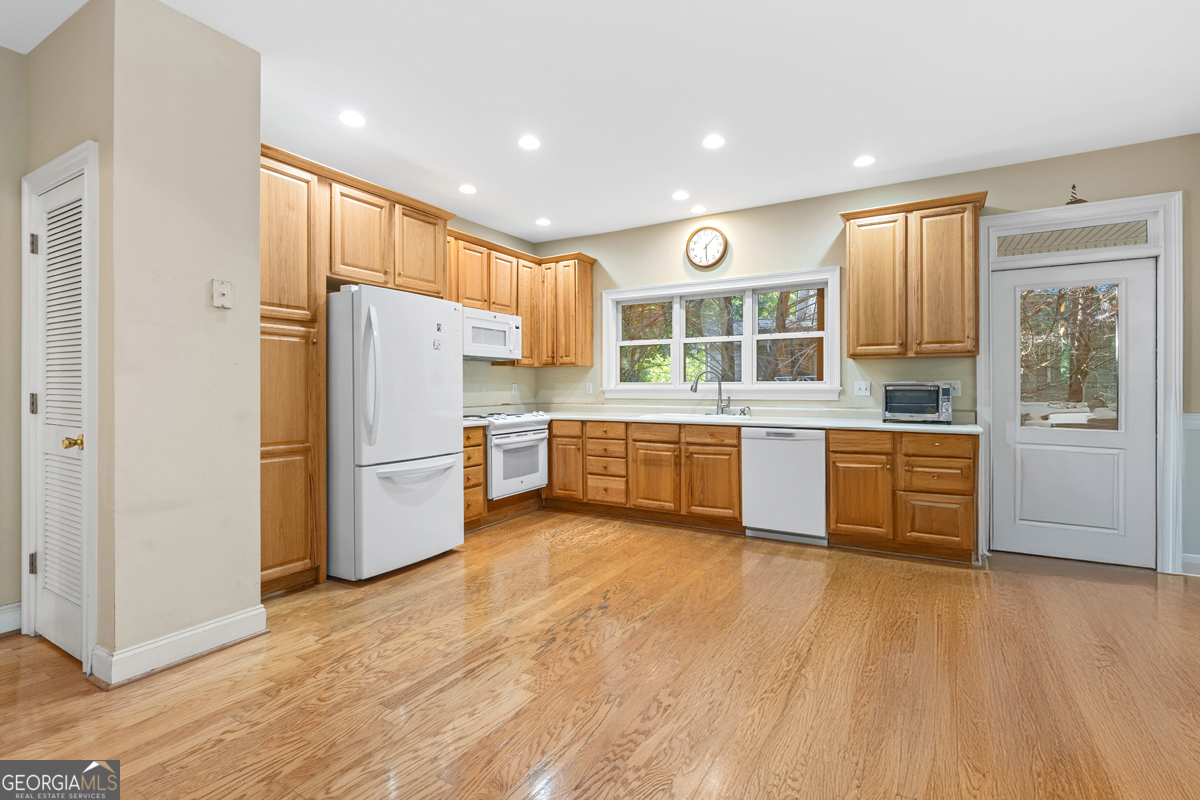 122 Hodges Lane Hartwell, GA 30643 - Photo 29 of 37 a kitchen with a refrigerator and a stove top oven
