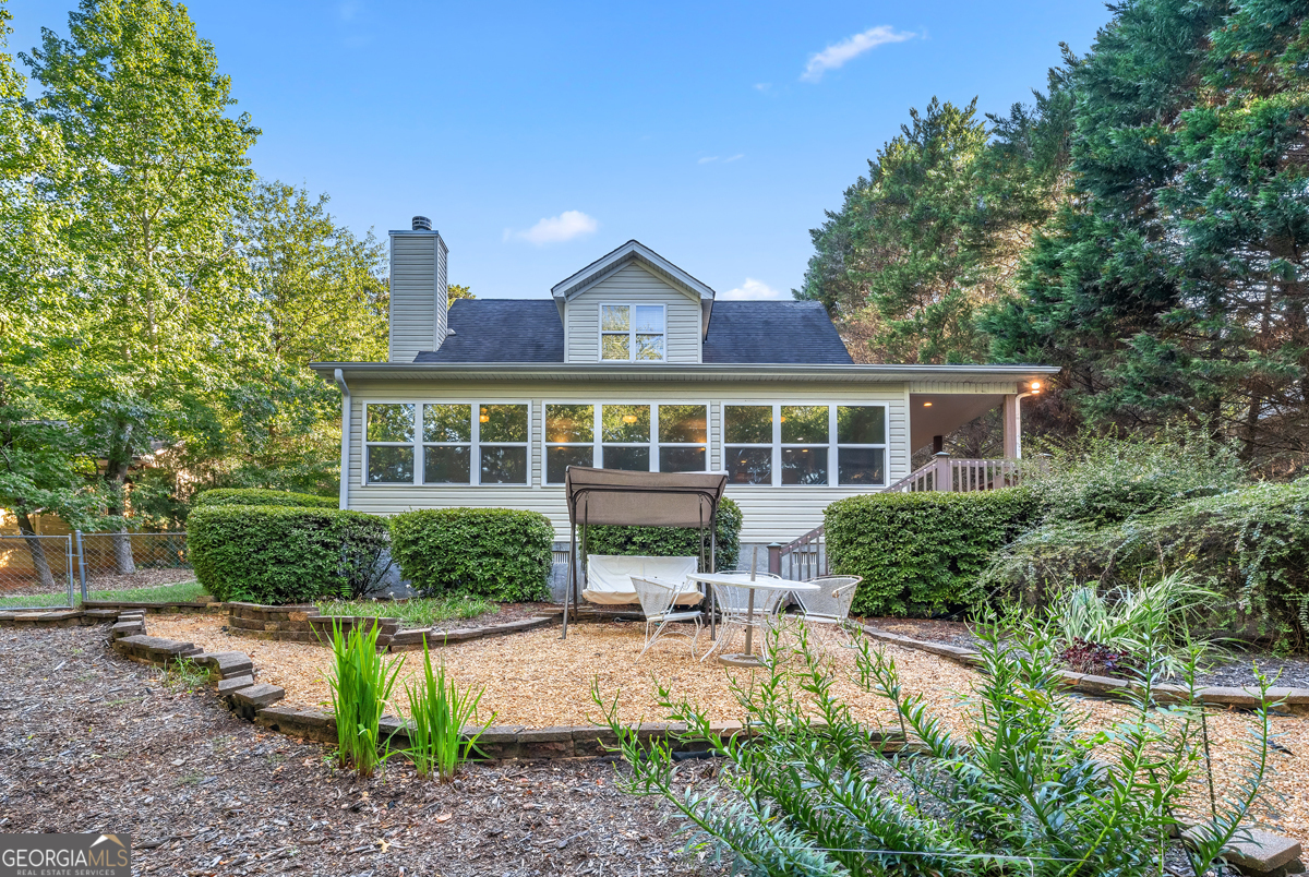 122 Hodges Lane Hartwell, GA 30643 - Photo 3 of 37 a house view with a seating space and garden