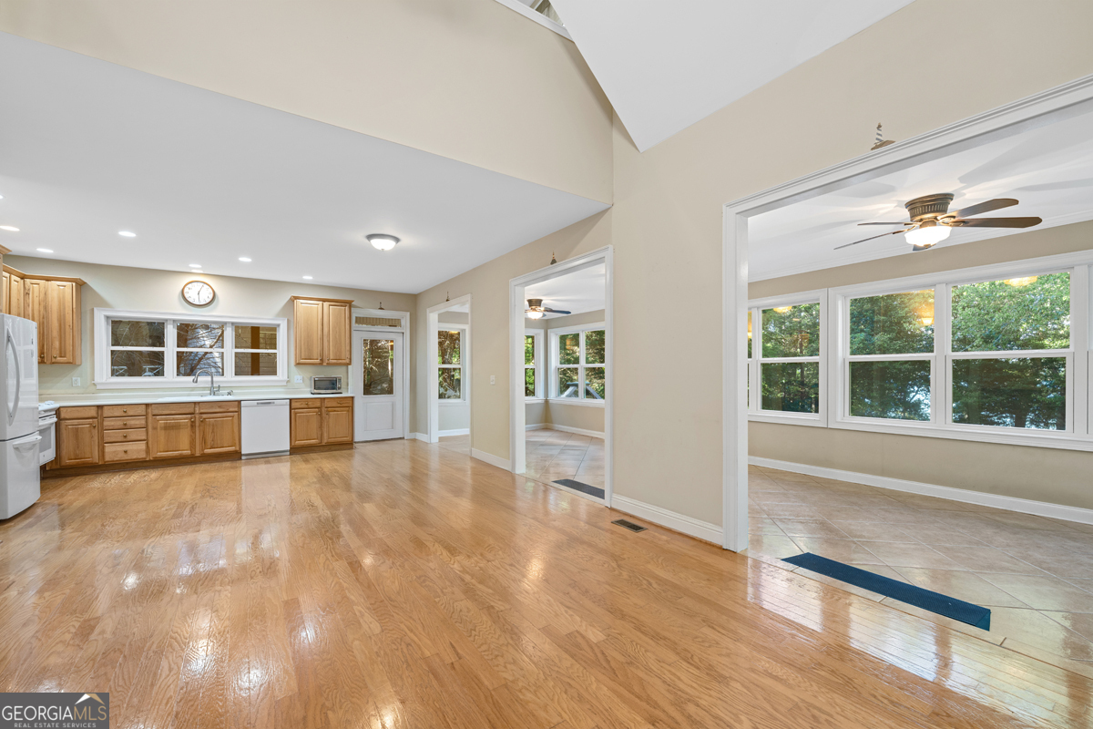 122 Hodges Lane Hartwell, GA 30643 - Photo 31 of 37 a view of an empty room with wooden floor and a window