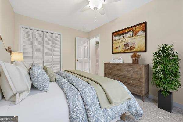 122 Hodges Lane Hartwell, GA 30643 - Photo 37 of 37 a bedroom with a large bed and a potted plant