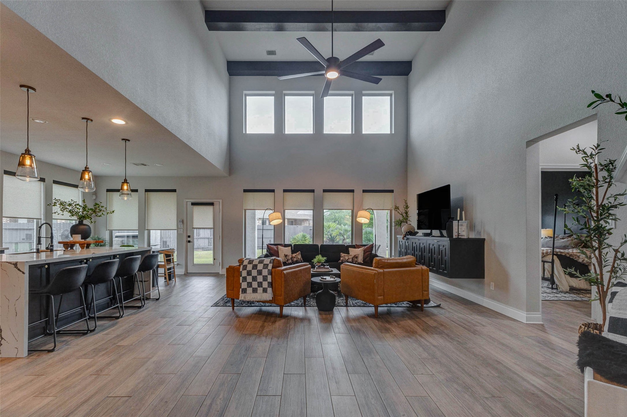 4303 Tupelo Leaf Court Manvel, TX 77578 - Photo 4 of 50 a living room with furniture a flat screen tv and a large window