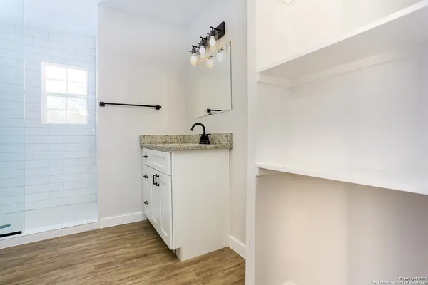 a bathroom with a sink and a mirror