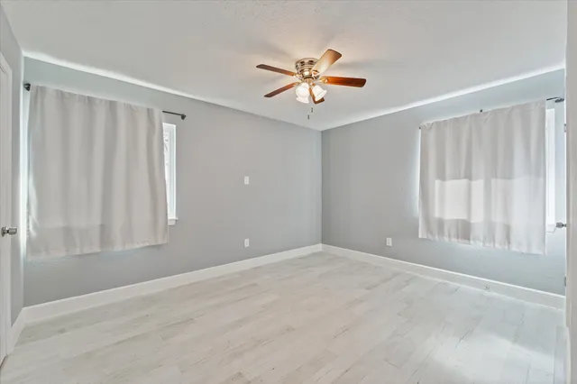 a view of house with backyard