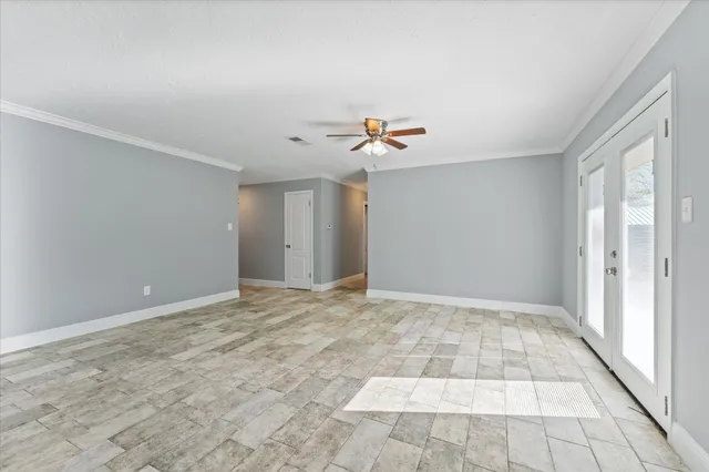a kitchen with granite countertop a sink stainless steel appliances and cabinets