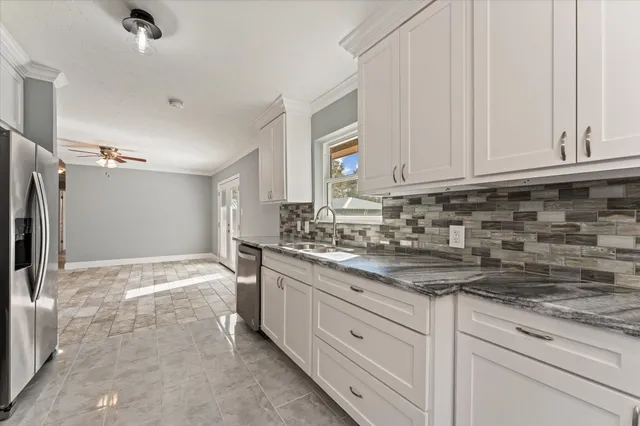 a bathroom with a shower a toilet and sink