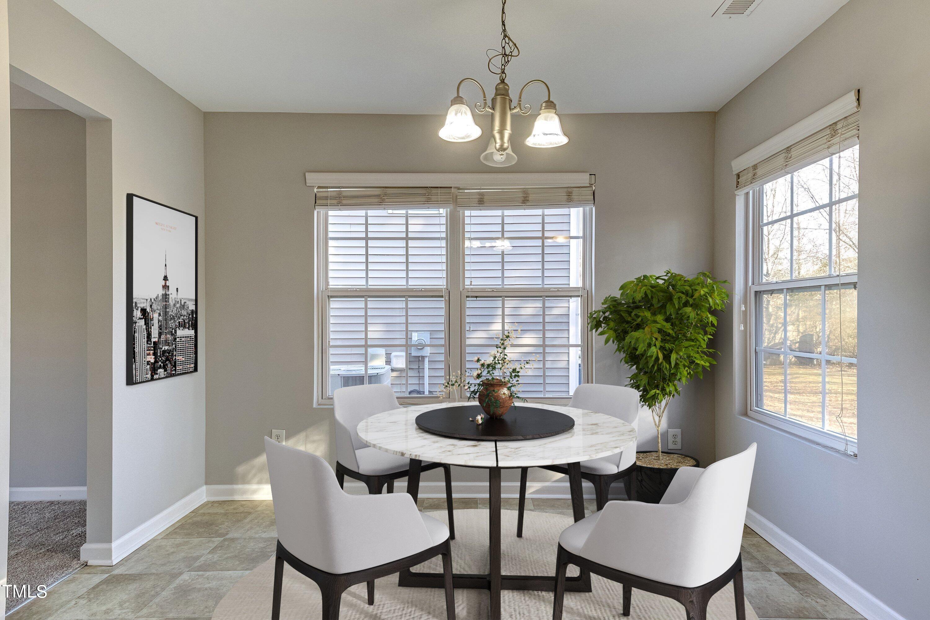 1334 Ricochet Drive Raleigh, NC 27610 - Photo 13 of 40 a view of a dining room with furniture and window