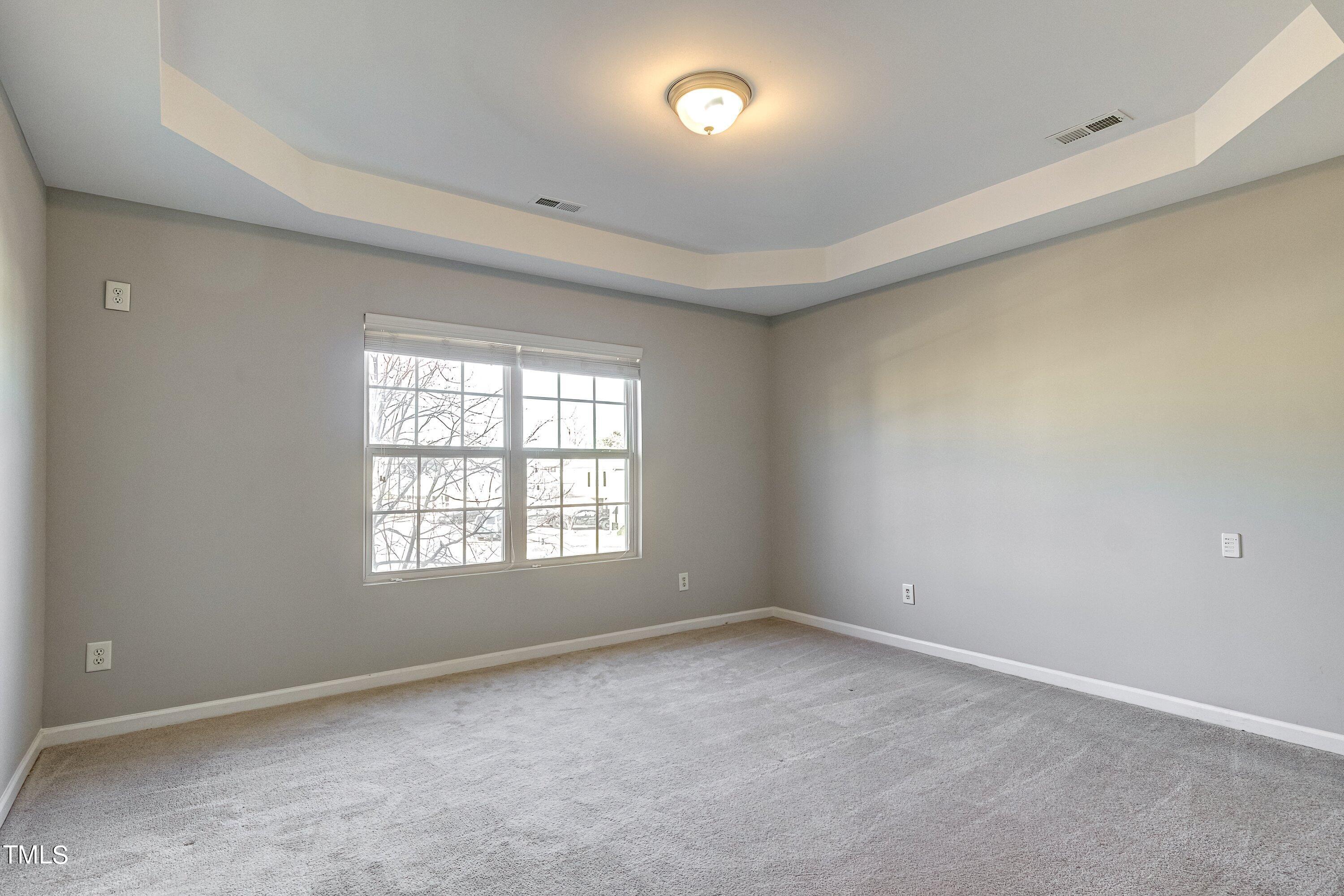 1334 Ricochet Drive Raleigh, NC 27610 - Photo 24 of 40 an empty room with a window