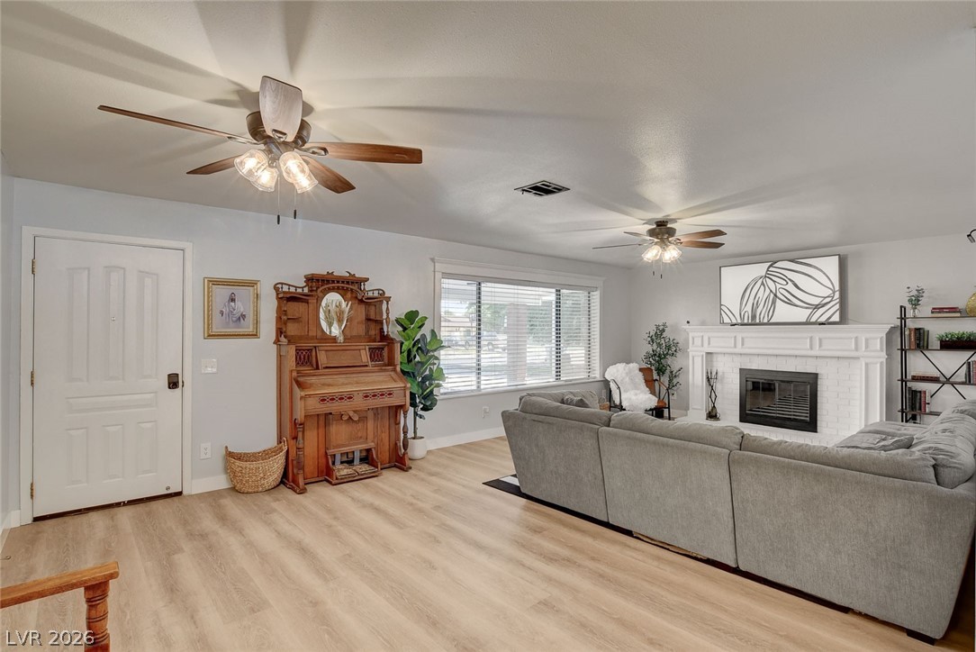 3765 Berkeley Street Logandale, NV 89021 - Photo 16 of 87 This bright living space features durable LVP flooring and ample natural light, ideal for comfortable gatherings.
