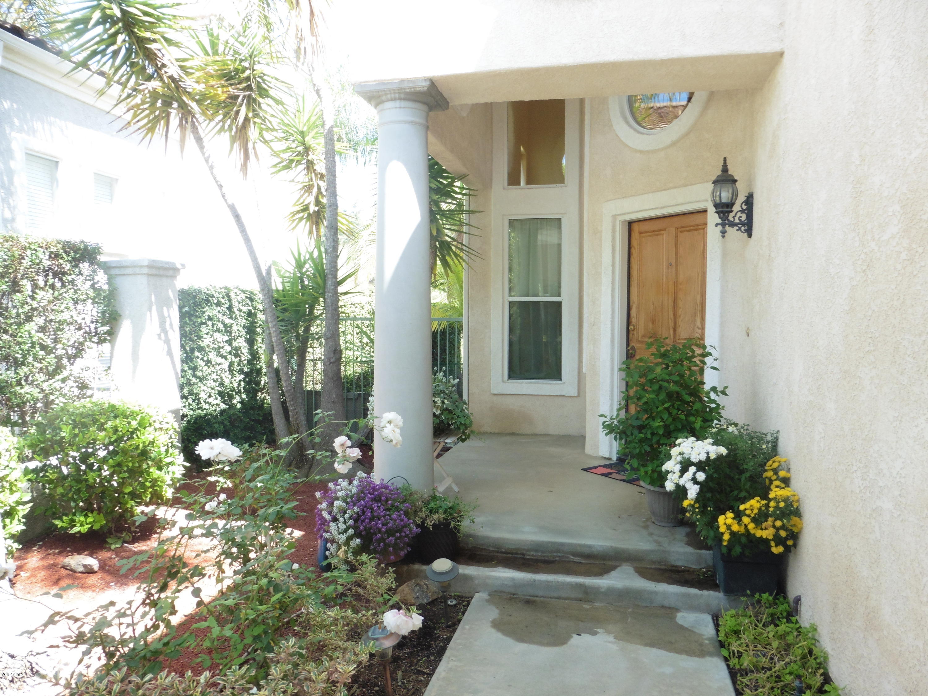 11285 Shadyridge Road Moorpark, CA 93021 - Photo 3 of 31 a view of a house with a flower garden