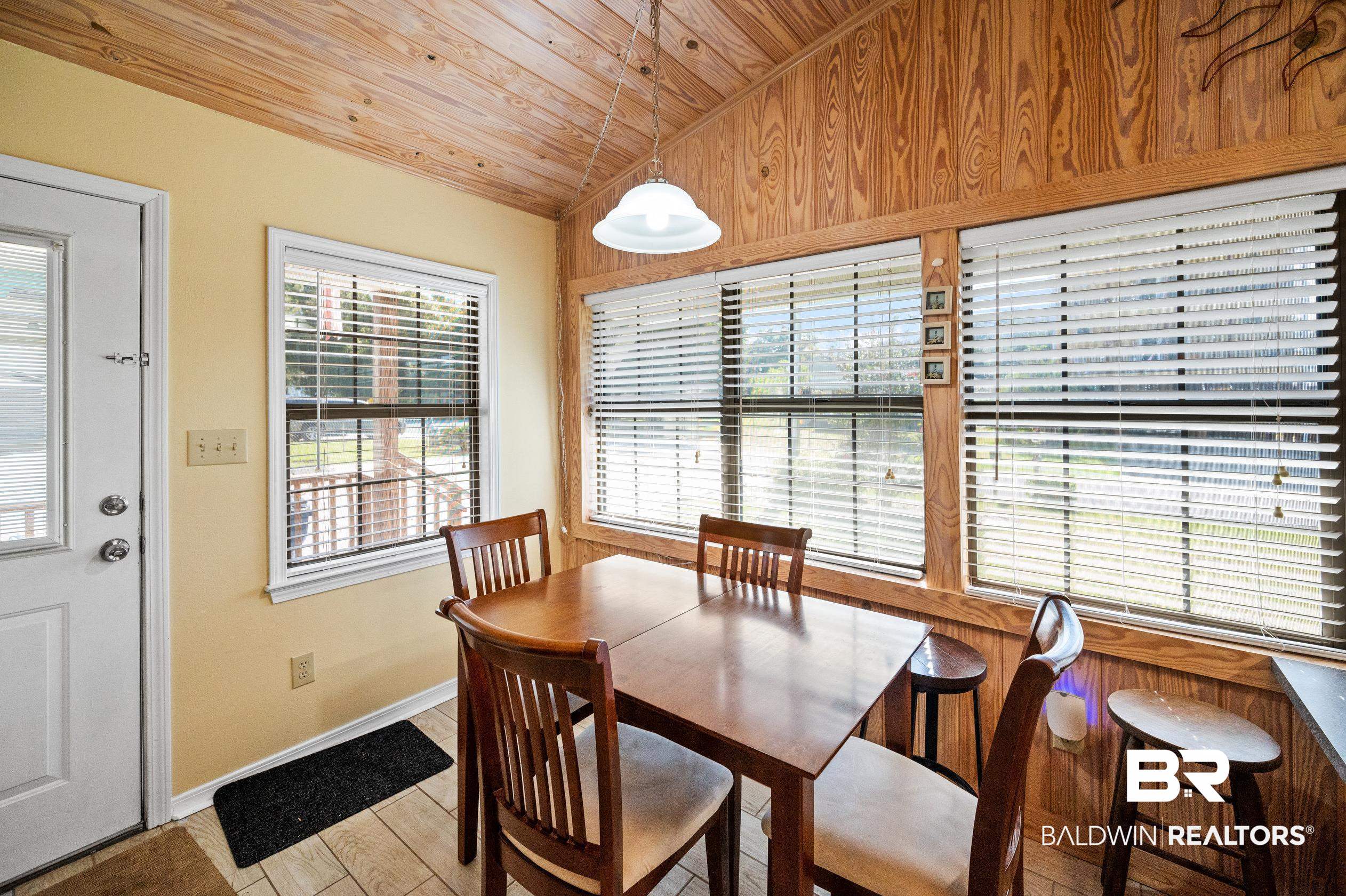 5392 Ornacor Avenue Orange Beach, AL 36561 - Photo 9 of 48 Dining room with wood ceiling, light hardwood / wood-style flooring, and lofted ceiling