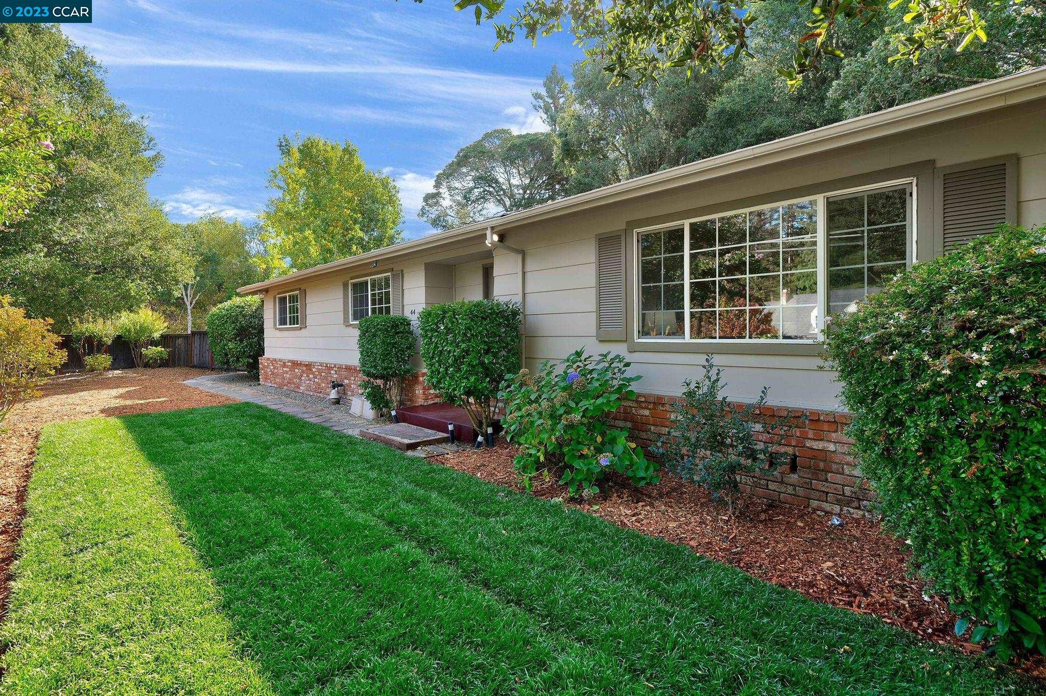 44 Rheem Boulevard Orinda, CA 94563 - Photo 1 of 1 a house that has a lot of plants in it