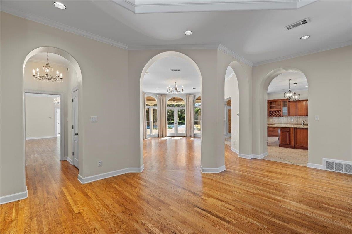 170 Jamerson Farm Road Collierville, TN 38017 - Photo 17 of 40 Interior space with light hardwood / wood-style flooring, an inviting chandelier, and ornamental molding