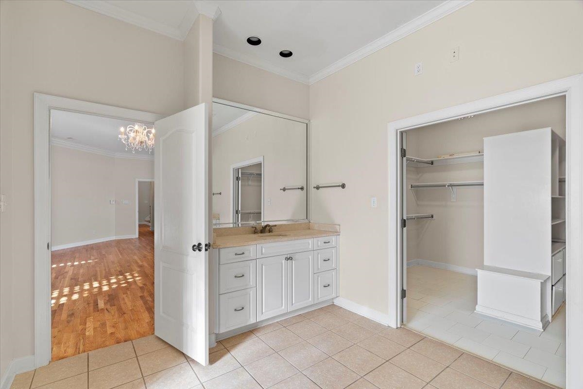 170 Jamerson Farm Road Collierville, TN 38017 - Photo 23 of 40 Bathroom featuring hardwood / wood-style flooring, vanity, ornamental molding, and a chandelier
