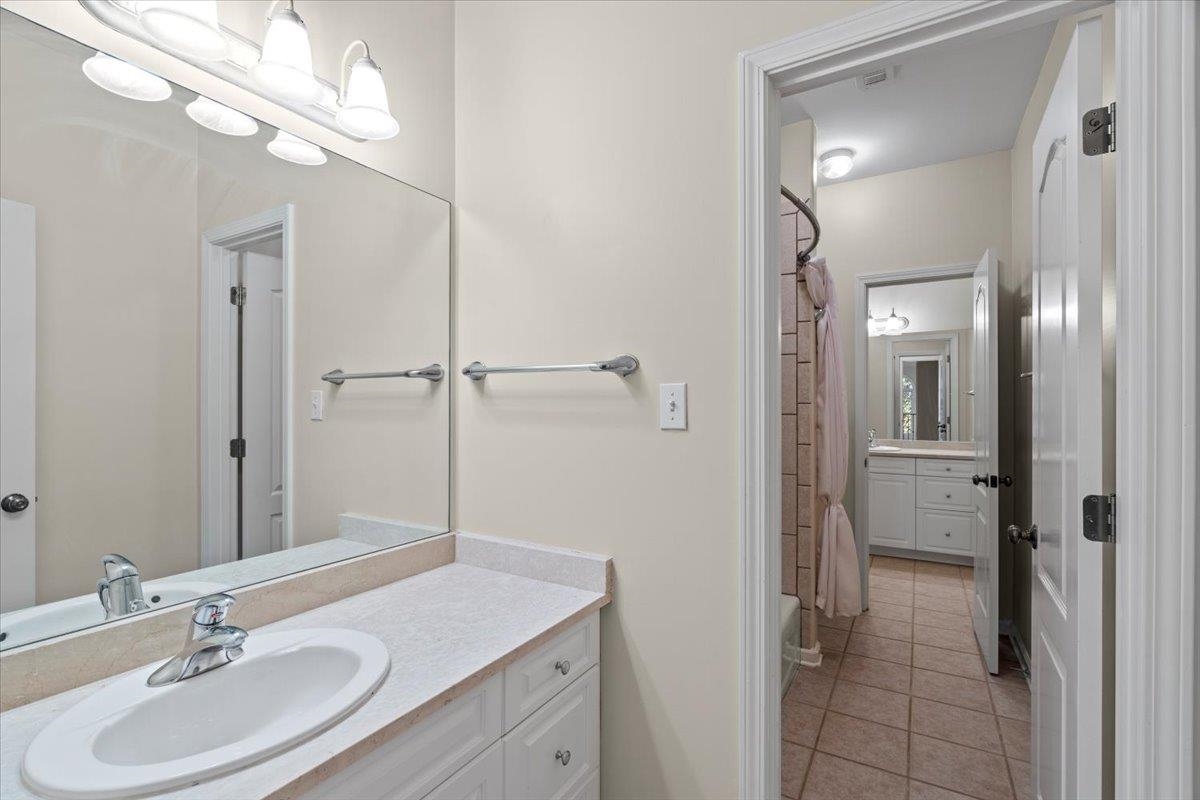 170 Jamerson Farm Road Collierville, TN 38017 - Photo 30 of 40 Bathroom featuring tile patterned floors, vanity, and shower / bath combo with shower curtain