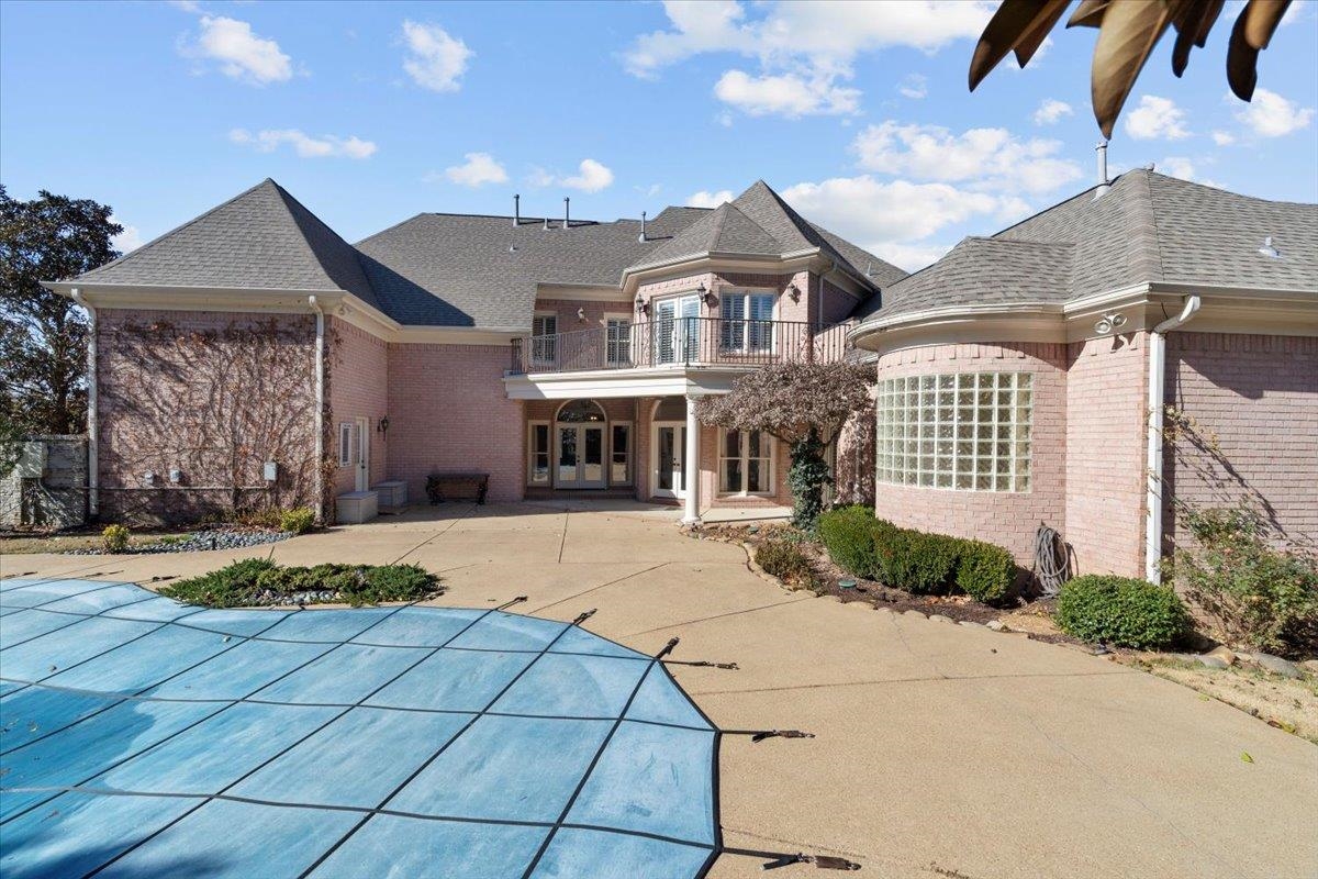 170 Jamerson Farm Road Collierville, TN 38017 - Photo 36 of 40 Back of property featuring a balcony, a patio, and a covered pool