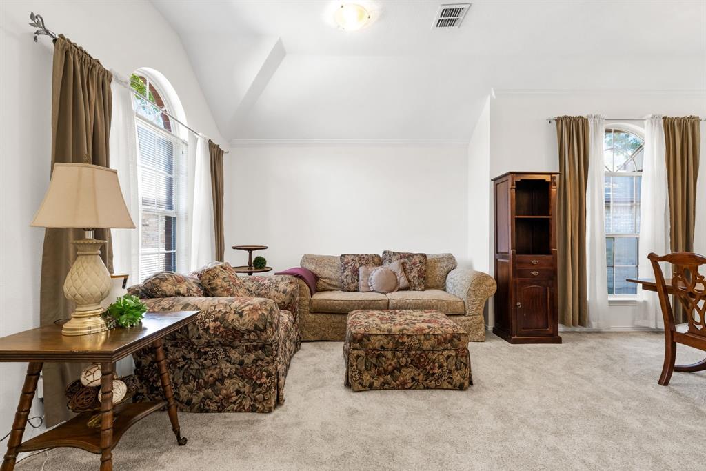 10903 Robincreek Lane Frisco, TX 75035 - Photo 3 of 17 a living room with furniture and a lamp