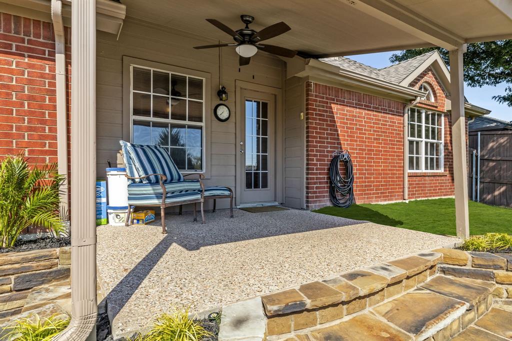 10903 Robincreek Lane Frisco, TX 75035 - Photo 4 of 17 a backyard of a house with seating space