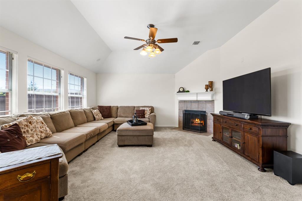 10903 Robincreek Lane Frisco, TX 75035 - Photo 9 of 17 a living room with furniture and a flat screen tv