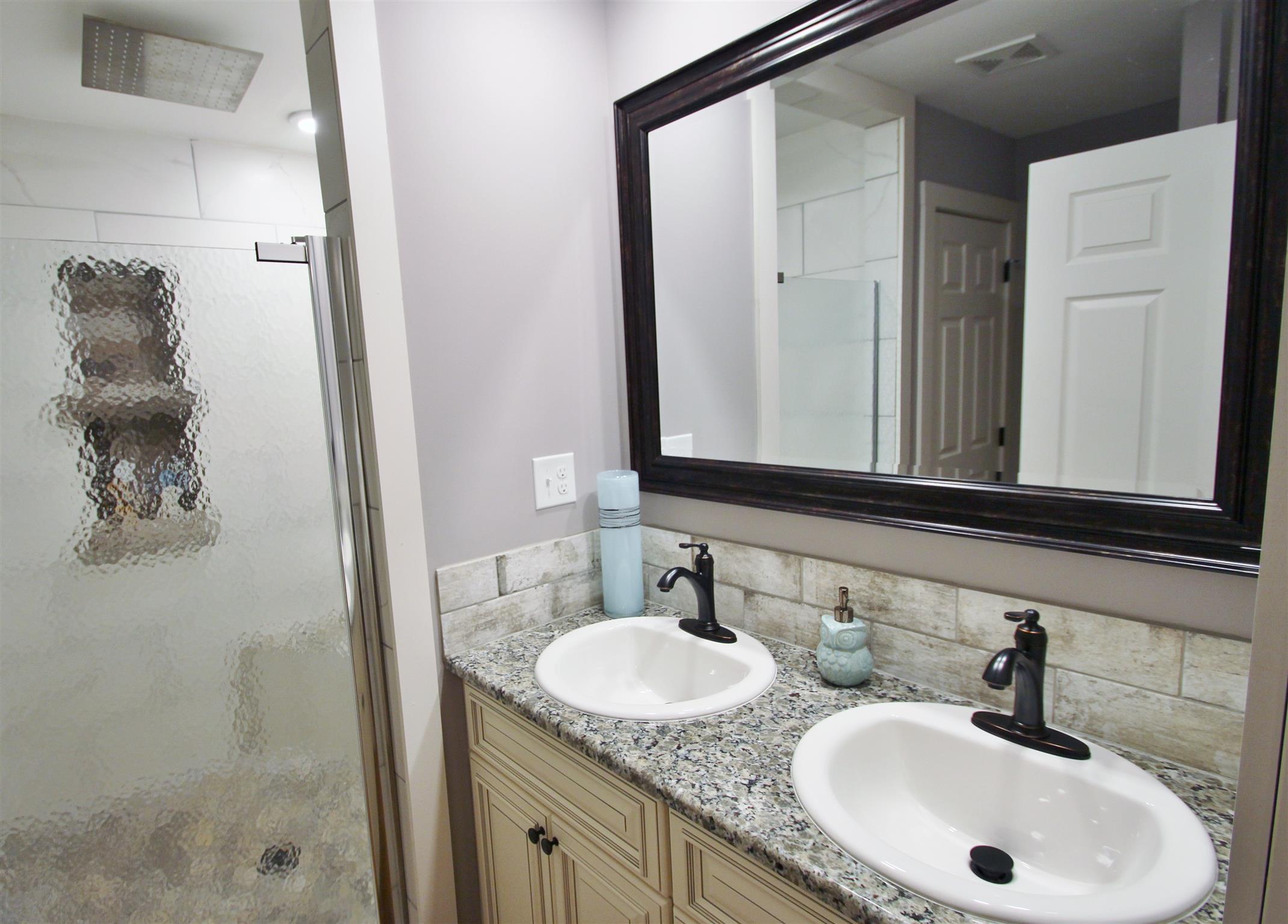 54 Snow Tree Bend Manchester, TN 37355 - Photo 11 of 16 a bathroom with double sink and two mirror