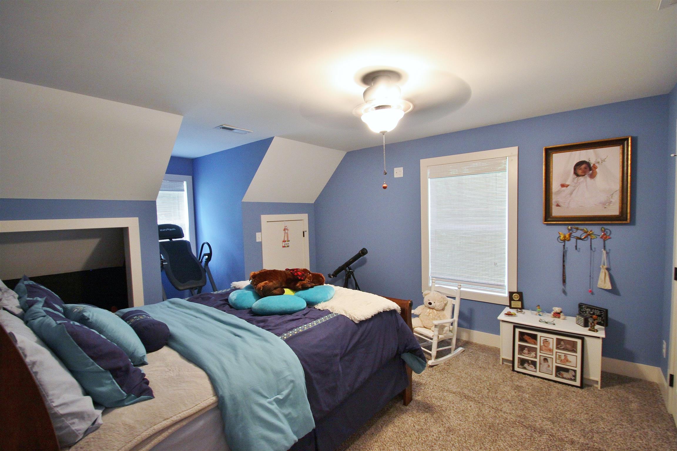 54 Snow Tree Bend Manchester, TN 37355 - Photo 12 of 16 a bedroom with a bed a couch and dresser