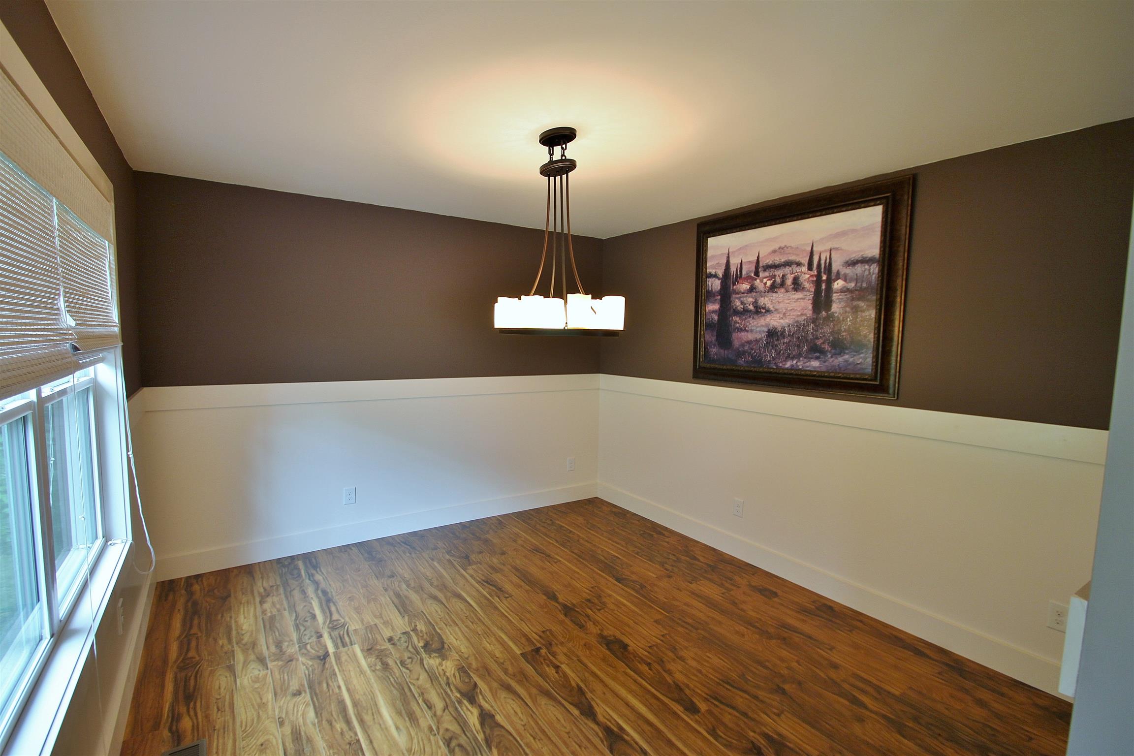 54 Snow Tree Bend Manchester, TN 37355 - Photo 3 of 16 a view of a room with wooden floor ceiling fan and a window