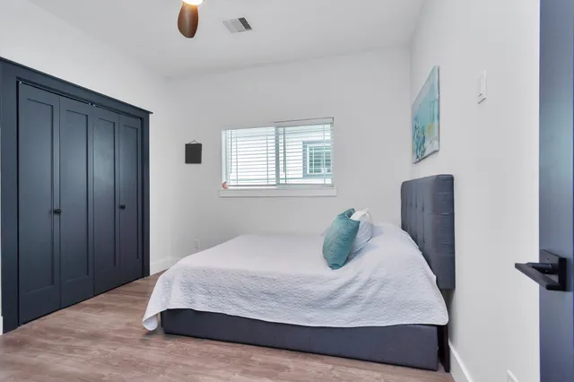 a bedroom with a bed and window