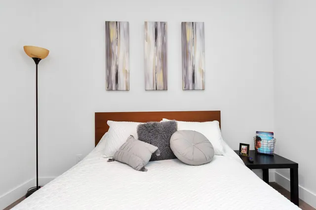 a bedroom with bed and window