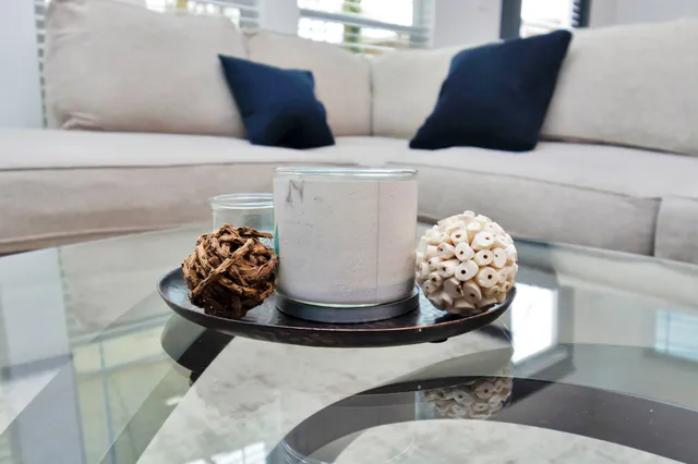 a table and a vase of flowers sitting on a table