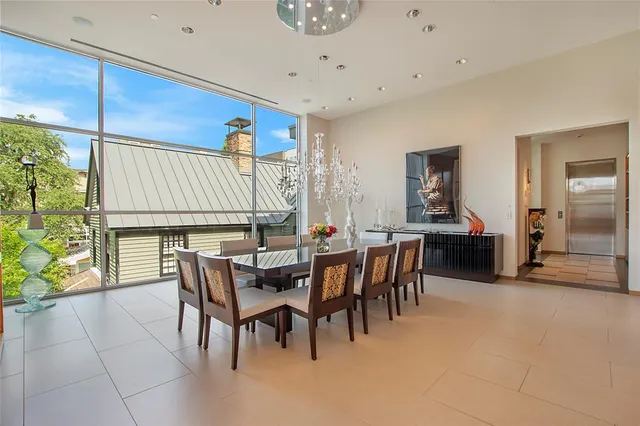 a dining room with furniture and window