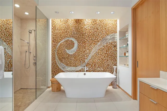 a bathroom with a bathtub and a shower