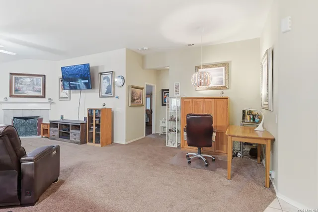 a view of a livingroom with workspace and a couch