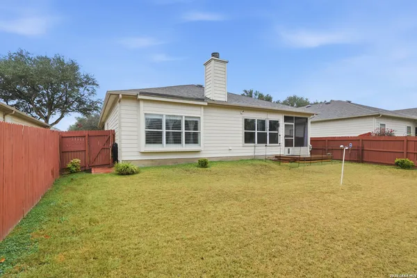 a house view with swimming pool in front of it
