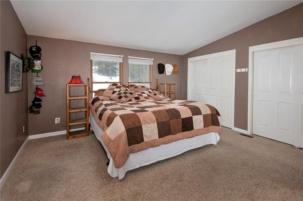 76 Lakeside Drive Dillon, CO 80435 - Photo 14 of 23 a bedroom with a bed and a window